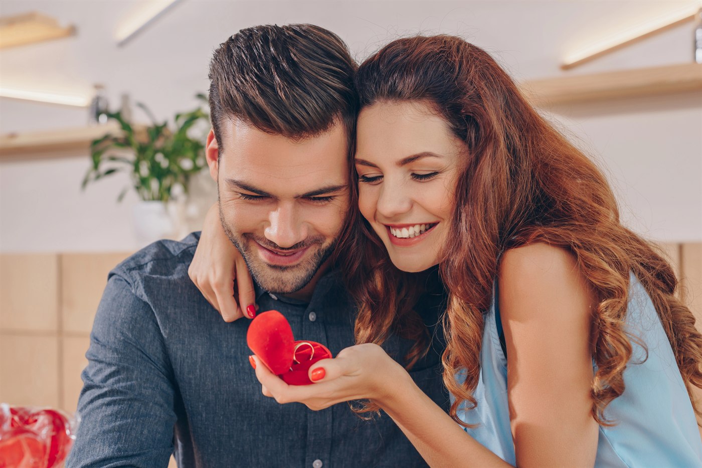 Engaged couple celebrating their proposal