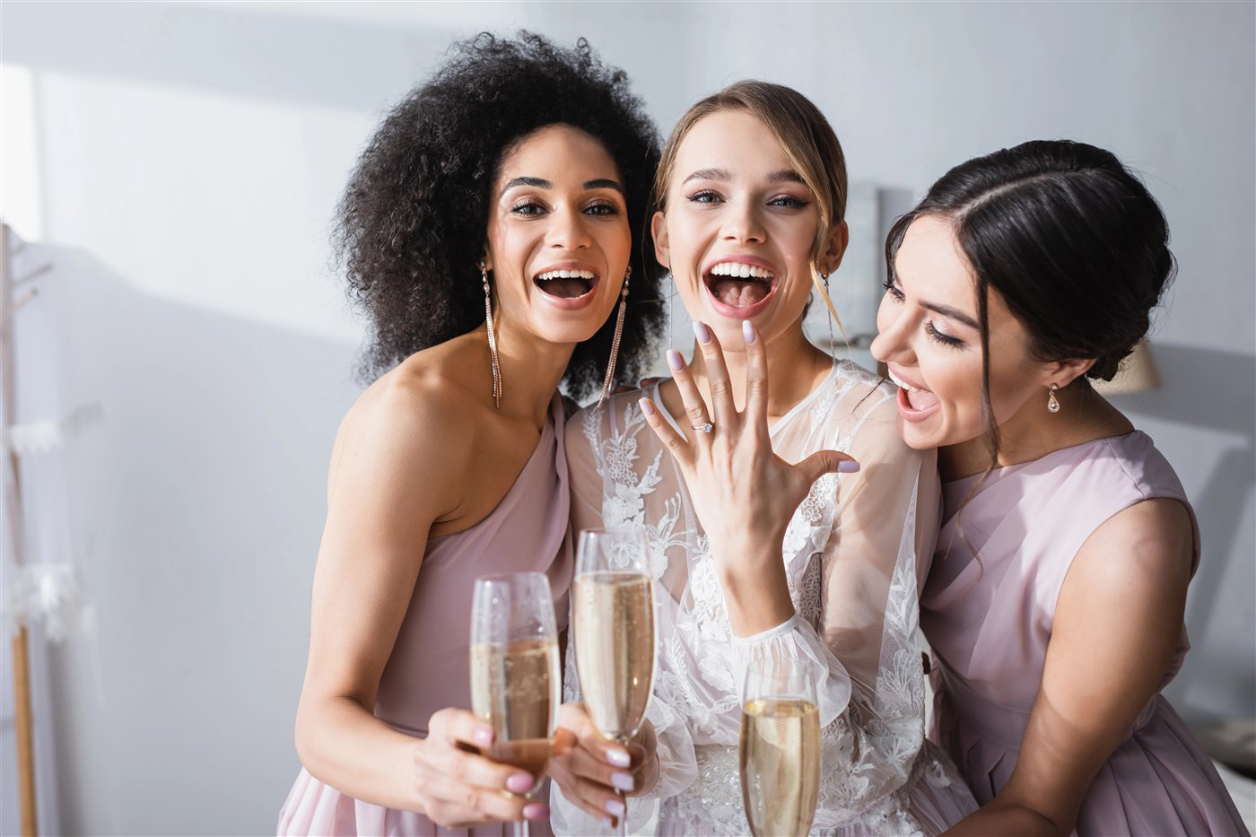 Bride celebrating with friends and champagne